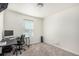 Versatile bedroom with two desks, comfortable chair, and natural light from the large window at 803 N Bently St, Watkins, CO 80137