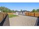 Expansive backyard with a mix of green turf, mulch, and gravel, enclosed by a wooden fence for privacy at 3200 N Elizabeth St, Denver, CO 80205