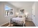 Bright bedroom with a cozy rug, fresh natural light, and simple decor at 3200 N Elizabeth St, Denver, CO 80205