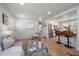 Open living area with wood floors seamlessly flows into the kitchen at 3200 N Elizabeth St, Denver, CO 80205