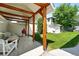 Inviting backyard features a pergola with wood posts, a seating area, and a well-manicured lawn at 1451 S Columbine St, Denver, CO 80210