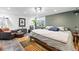 Basement bedroom with leather chair, tiled floors and drop ceiling at 1451 S Columbine St, Denver, CO 80210