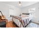 Inviting bedroom featuring hardwood floors and ample natural light at 1451 S Columbine St, Denver, CO 80210