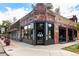 Exterior view of brick building showcasing architectural details, large windows, and outdoor signage at 1451 S Columbine St, Denver, CO 80210