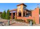 Exterior view of a French bakery and cafe with brick architecture, tasteful landscaping, and a welcoming ambiance at 1451 S Columbine St, Denver, CO 80210
