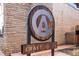 Exterior view of Craft Alley; features a logo sign with a stylized hop flower inside a circle at 1451 S Columbine St, Denver, CO 80210