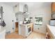 Well-lit kitchen with modern appliances, wood cabinetry, and an open layout design at 1451 S Columbine St, Denver, CO 80210