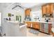 Kitchen with stainless steel appliances, light wood cabinetry, and a window view at 1451 S Columbine St, Denver, CO 80210