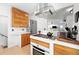 Kitchen with modern appliances, a gas range, wood cabinets, and an open layout at 1451 S Columbine St, Denver, CO 80210