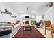 Inviting living room with a fireplace, hardwood floors, and comfortable seating at 1451 S Columbine St, Denver, CO 80210