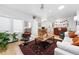 Bright living room featuring hardwood floors, neutral walls, and a ceiling fan at 1451 S Columbine St, Denver, CO 80210