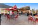 Stylish outdoor patio with red chairs and umbrellas, perfect for dining at 1451 S Columbine St, Denver, CO 80210