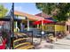 Charming restaurant exterior with colorful umbrellas, outdoor seating, and vibrant signage at 1451 S Columbine St, Denver, CO 80210