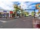 Street view featuring vibrant storefronts under a sunny sky with a clear view of the South Pearl Street sign at 1451 S Columbine St, Denver, CO 80210