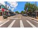 Street view of South Gaylord Street with shops, trees, parked cars, and a crosswalk at 1451 S Columbine St, Denver, CO 80210