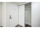 Bright entryway featuring a secure front door, coat closet, and durable flooring at 956 S Peoria St, Aurora, CO 80012