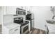 Kitchen with white cabinets, stainless appliances, and stylish countertops at 956 S Peoria St, Aurora, CO 80012