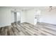 Spacious living room featuring stylish floors, fresh paint, and natural light at 956 S Peoria St, Aurora, CO 80012