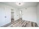 Bright main bedroom with new floors, closet, ensuite, and crisp white paint and trim at 956 S Peoria St, Aurora, CO 80012