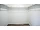 Walk-in closet with ample storage and custom shelving and rack system at 956 S Peoria St, Aurora, CO 80012