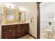 Elegant bathroom with double vanity, granite countertops, and separate toilet room at 3021 N Lakeridge Trl, Boulder, CO 80302