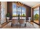 Elegant dining room with a stylish chandelier and amazing scenic views at 3021 N Lakeridge Trl, Boulder, CO 80302