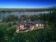Stunning lakefront home with expansive deck, mature landscaping, and scenic mountain views at 3021 N Lakeridge Trl, Boulder, CO 80302