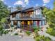 Two-story home with multi-level deck, stone accents, and landscaped yard at 3021 N Lakeridge Trl, Boulder, CO 80302
