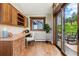 Inviting home office with custom wood built-ins, desk, and sliding glass door to the outside deck and views at 3021 N Lakeridge Trl, Boulder, CO 80302