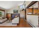 Bright living room with a brick fireplace, open layout, and seamless integration with the kitchen at 3021 N Lakeridge Trl, Boulder, CO 80302