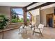 Light-filled living room with beautiful windows, brick accents, and serene outdoor views, perfect for relaxation at 3021 N Lakeridge Trl, Boulder, CO 80302