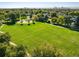 Overhead shot of the park featuring lush green grass, a playground, and walking trails at 3674 Dexter St, Denver, CO 80207