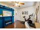 Versatile room with exercise equipment, ladder, and blue shelving; great for a home gym or office at 3674 Dexter St, Denver, CO 80207
