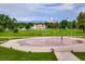 Scenic park view featuring an interactive fountain with the city skyline and mountains in the distance at 3674 Dexter St, Denver, CO 80207