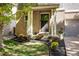 Charming front porch featuring brick accents, a decorative flower bed, and a welcoming entrance at 3674 Dexter St, Denver, CO 80207