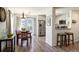 Open-concept layout featuring a dining area, modern kitchen, and stainless steel appliances at 3674 Dexter St, Denver, CO 80207