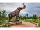 Intricate statue of a mammoth in City Park near lake with the Denver skyline in the background at 3674 Dexter St, Denver, CO 80207