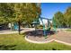 Community playground featuring swings, slides, and a shaded picnic area for Gathering enjoyment at 3674 Dexter St, Denver, CO 80207