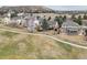 A neighborhood situated near a golf course boasts meticulously maintained lawns and mature trees, surrounded by a scenic landscape at 401 W Prestwick Way, Castle Rock, CO 80104