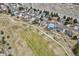 A high up view of the community homes that are next to a putting green and have a walking path at 401 W Prestwick Way, Castle Rock, CO 80104