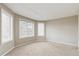 Bedroom features neutral walls, carpet and natural light from large windows at 401 W Prestwick Way, Castle Rock, CO 80104