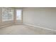 Bedroom features neutral walls, carpet and natural light from a large window at 401 W Prestwick Way, Castle Rock, CO 80104