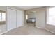 Bedroom features closet space and connects to a main bedroom with ceiling fan at 401 W Prestwick Way, Castle Rock, CO 80104