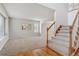 Open living area with neutral carpet and staircase at 401 W Prestwick Way, Castle Rock, CO 80104