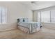 Main bedroom with neutral walls, carpet, ceiling fan and natural light from large windows at 401 W Prestwick Way, Castle Rock, CO 80104