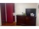 Bedroom with modern TV and dresser against a wall at 160 Utica St, Denver, CO 80219