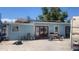 Exterior view of the back of the home with a spacious yard area at 160 Utica St, Denver, CO 80219