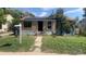 A charming home with lovely lawn and solar panels on the roof at 160 Utica St, Denver, CO 80219