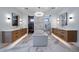 Bright bathroom showcasing a freestanding tub, dual vanities, marble accents, and a sauna at 5263 Creation Rock Trl, Morrison, CO 80465