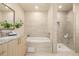 Spa-like bathroom with soaking tub, walk-in shower, and modern vanity at 7234 S Fillmore Cir, Centennial, CO 80122